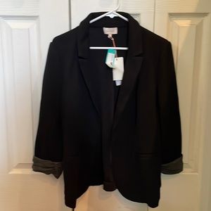 Black blazer with gray sleeve detail; Skies are Blue by StitchFix